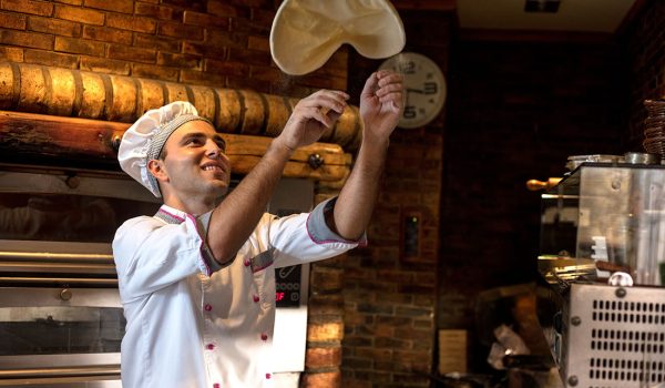 Chef preparing pizza dough